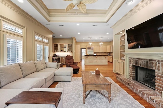 26 Little Comfort Rd, Savannah, GA 31411 - living room featuring ornamental molding, light wood-style floors, a fireplace, a ceiling fan, and recessed lighting