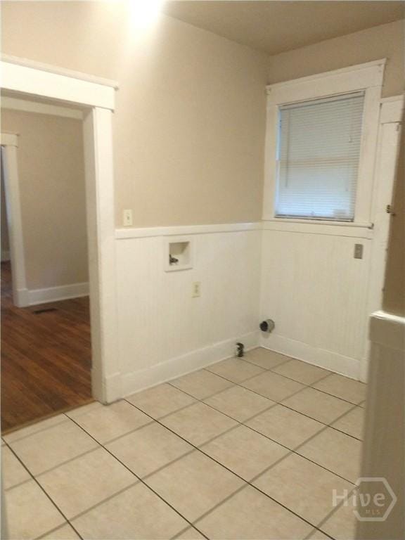 908-910 E 34th St, Savannah, GA 31401 - laundry area featuring hookup for a washing machine, wainscoting, and light tile patterned floors