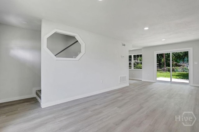 2204 Beaumont Dr, Savannah, GA 31406 - unfurnished room with recessed lighting, light wood-style floors, and stairway