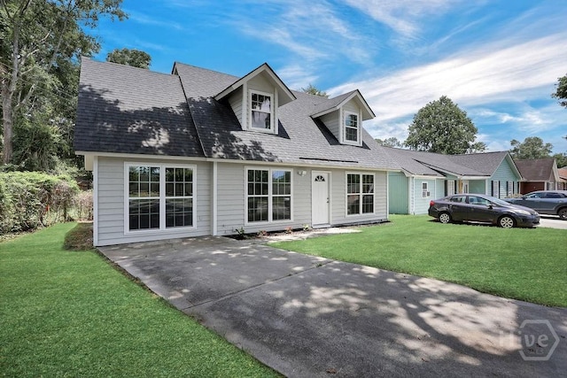 2204 Beaumont Dr, Savannah, GA 31406 - cape cod house with a front yard, roof with shingles, and a patio