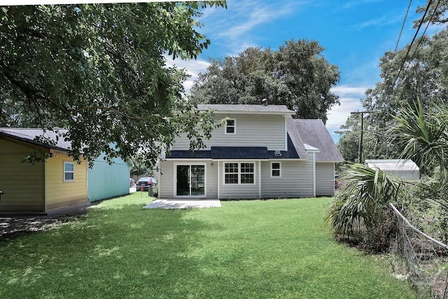 2204 Beaumont Dr, Savannah, GA 31406 - rear view of property with a lawn, a shingled roof, and a patio