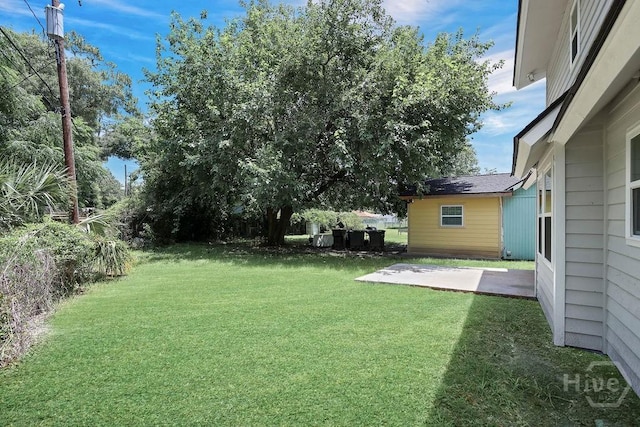 2204 Beaumont Dr, Savannah, GA 31406 - view of green lawn featuring a patio area