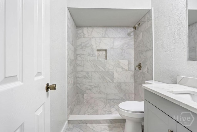 2204 Beaumont Dr, Savannah, GA 31406 - full bathroom featuring marble finish floors, vanity, tiled shower, and a textured wall