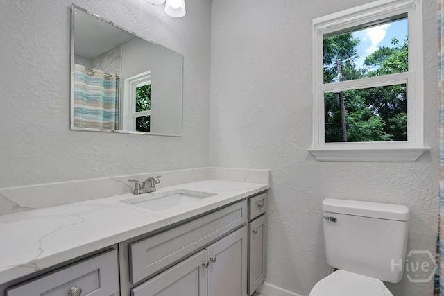 2204 Beaumont Dr, Savannah, GA 31406 - full bathroom featuring vanity, healthy amount of natural light, and a textured wall