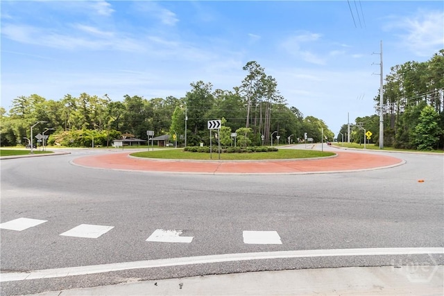 106 S Old Augusta Rd S, Rincon, GA 31326 - view of asphalt road featuring traffic signs, curbs, and street lights