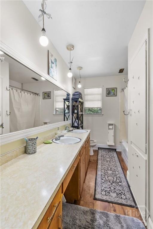 106 S Old Augusta Rd S, Rincon, GA 31326 - bathroom featuring vanity, shower / tub combo, and wood finished floors