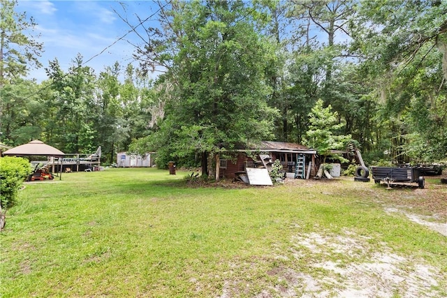 106 S Old Augusta Rd S, Rincon, GA 31326 - view of grassy yard featuring a storage shed