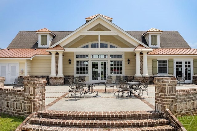 224 Lakeside Dr, Port Wentworth, GA 31407 - rear view of property with french doors, a patio, a shingled roof, and a metal roof