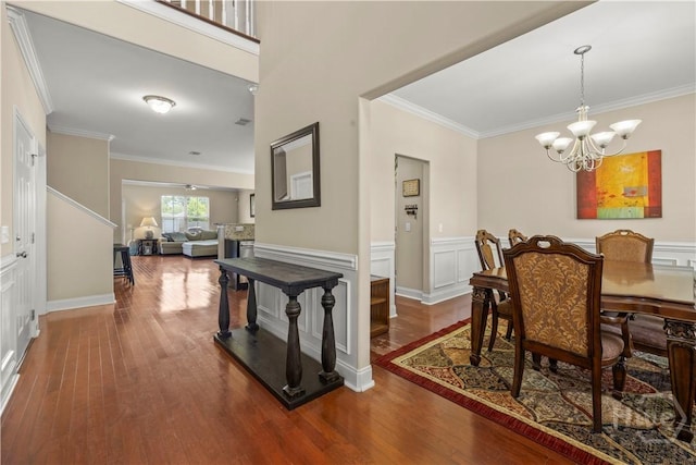 10 Broken Bit Rd, Ellabell, GA 31308 - dining area with wood finished floors, crown molding, a chandelier, and wainscoting