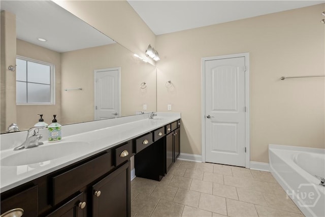10 Broken Bit Rd, Ellabell, GA 31308 - bathroom featuring double vanity, tile patterned floors, and a bath