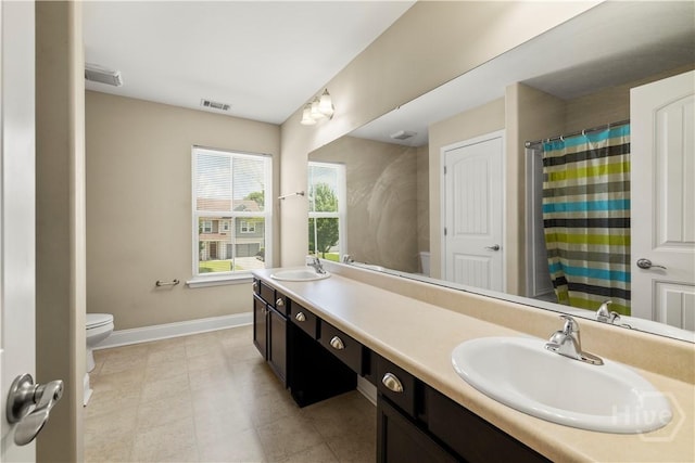 10 Broken Bit Rd, Ellabell, GA 31308 - full bath featuring double vanity, tile patterned flooring, and a shower with curtain