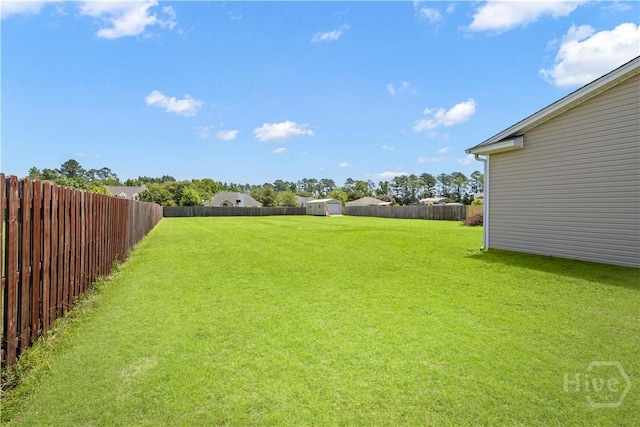 10 Broken Bit Rd, Ellabell, GA 31308 - fenced backyard with a storage shed