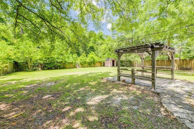 208 Lord Effingham Dr, Rincon, GA 31326 - fenced backyard with a storage unit and a pergola