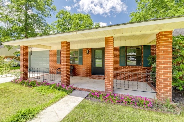 208 Lord Effingham Dr, Rincon, GA 31326 - single story home with a porch, brick siding, and an attached garage