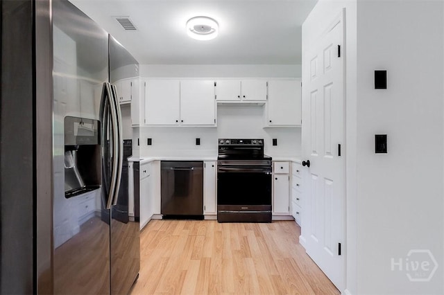 208 Lord Effingham Dr, Rincon, GA 31326 - kitchen with appliances with stainless steel finishes, light countertops, light wood-style flooring, and white cabinetry
