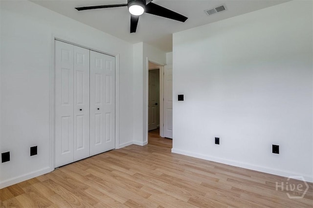 208 Lord Effingham Dr, Rincon, GA 31326 - unfurnished bedroom with light wood-style floors, a closet, and a ceiling fan