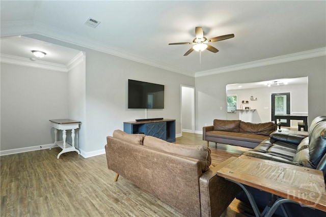1175 Ralph Rahn Rd, Rincon, GA 31326 - living room with a ceiling fan, wood finished floors, and crown molding