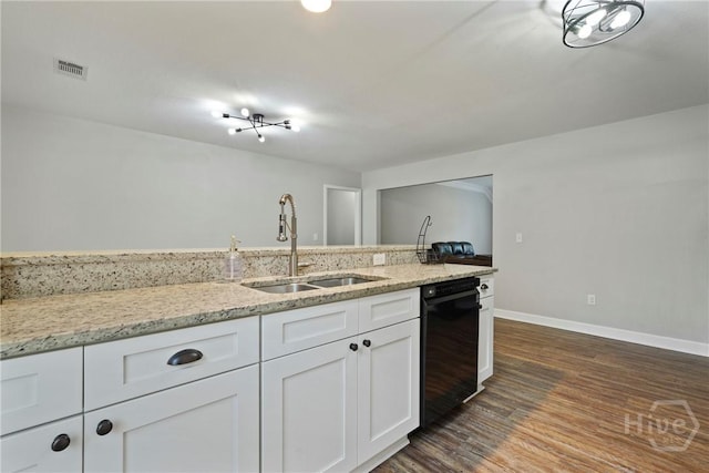 1175 Ralph Rahn Rd, Rincon, GA 31326 - kitchen featuring dishwasher, white cabinets, dark wood-style floors, and light stone countertops