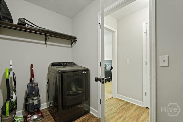 1175 Ralph Rahn Rd, Rincon, GA 31326 - laundry area featuring washer / clothes dryer and wood finished floors