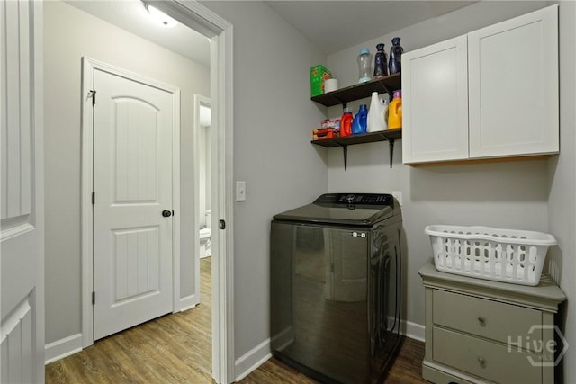 1175 Ralph Rahn Rd, Rincon, GA 31326 - washroom featuring dark wood-style flooring, cabinet space, and independent washer and dryer