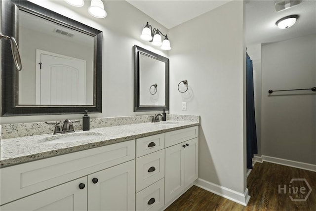 1175 Ralph Rahn Rd, Rincon, GA 31326 - full bathroom featuring double vanity, wood finished floors, and curtained shower