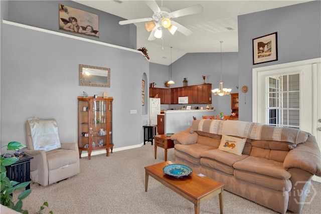 63 Stonelake Cir, Savannah, GA 31419 - living area featuring light colored carpet, ceiling fan, high vaulted ceiling, and a chandelier