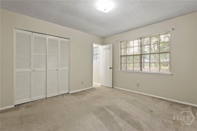 429 Edgewater Rd, Savannah, GA 31406 - unfurnished bedroom featuring a textured ceiling, a closet, and carpet flooring