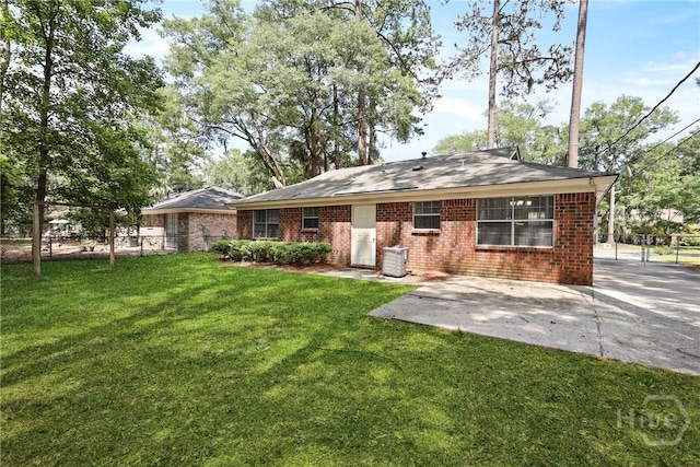 429 Edgewater Rd, Savannah, GA 31406 - rear view of house with a patio and brick siding