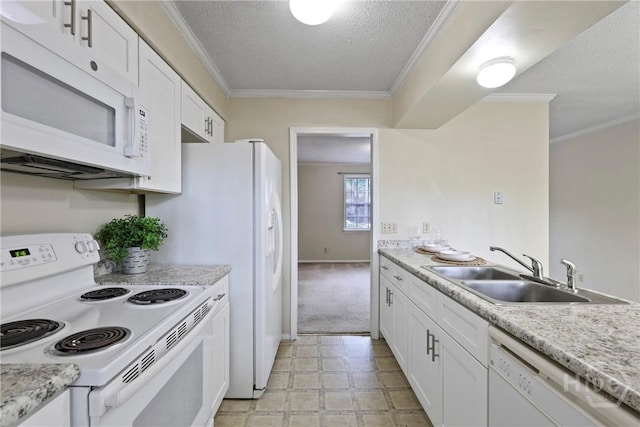429 Edgewater Rd, Savannah, GA 31406 - kitchen with white appliances, a textured ceiling, crown molding, white cabinets, and light colored carpet