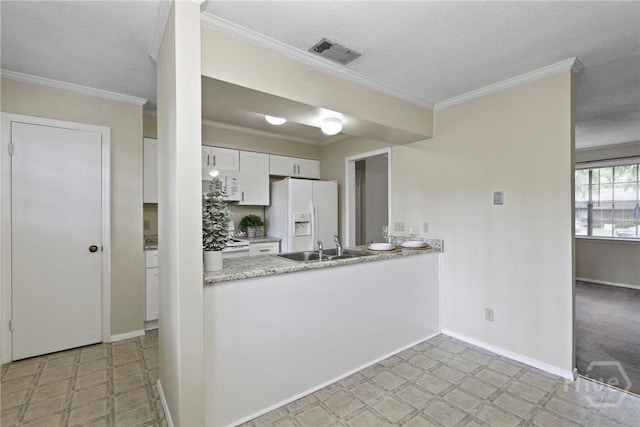 429 Edgewater Rd, Savannah, GA 31406 - kitchen with white appliances, light floors, crown molding, a textured ceiling, and white cabinetry