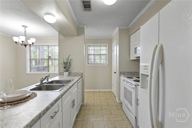 429 Edgewater Rd, Savannah, GA 31406 - kitchen featuring white appliances, a textured ceiling, white cabinetry, a chandelier, and light countertops