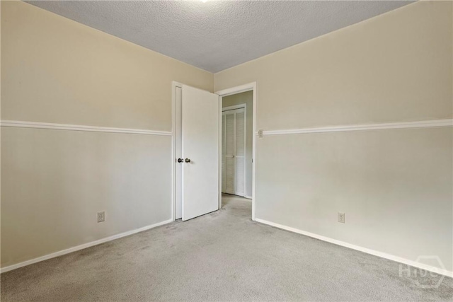 429 Edgewater Rd, Savannah, GA 31406 - carpeted spare room featuring baseboards and a textured ceiling