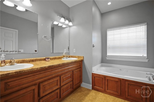 43 Gracie Ln NE, Ludowici, GA 31316 - full bathroom with double vanity, a garden tub, and tile patterned floors