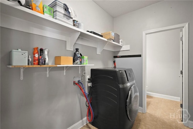 43 Gracie Ln NE, Ludowici, GA 31316 - laundry room with washer / clothes dryer and light tile patterned floors
