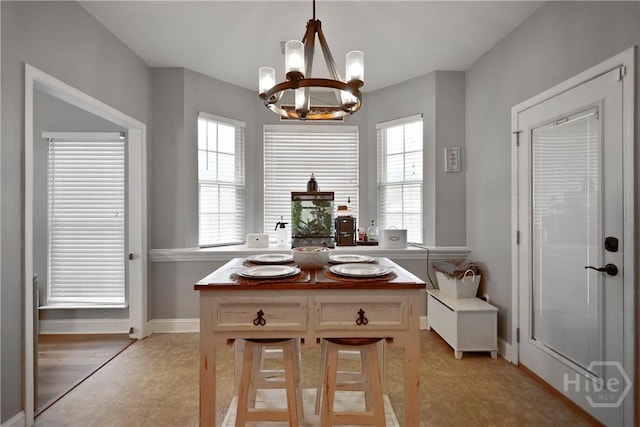 43 Gracie Ln NE, Ludowici, GA 31316 - dining space featuring a chandelier and healthy amount of natural light