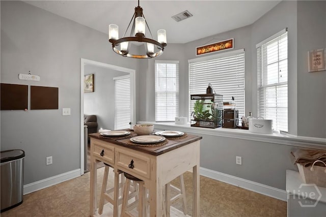 43 Gracie Ln NE, Ludowici, GA 31316 - dining space with a chandelier and light tile patterned floors