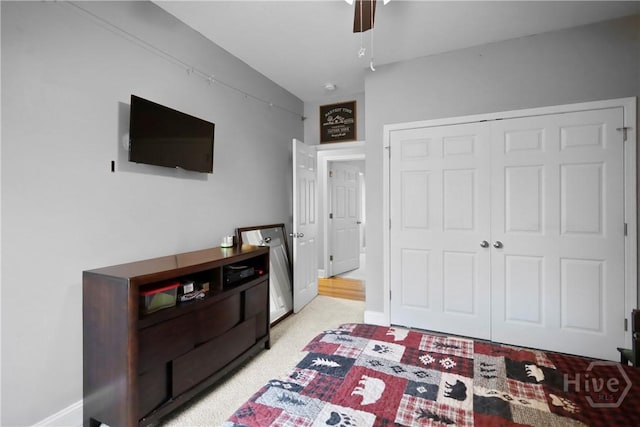 43 Gracie Ln NE, Ludowici, GA 31316 - bedroom featuring a closet, light colored carpet, and ceiling fan