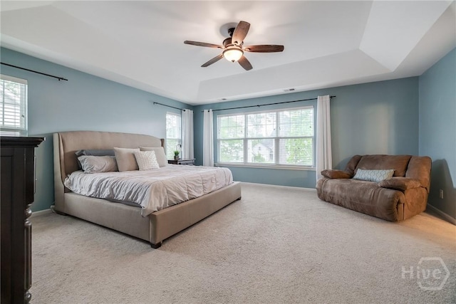 55 Glen Way, Richmond Hill, GA 31324 - carpeted bedroom with a tray ceiling and a ceiling fan