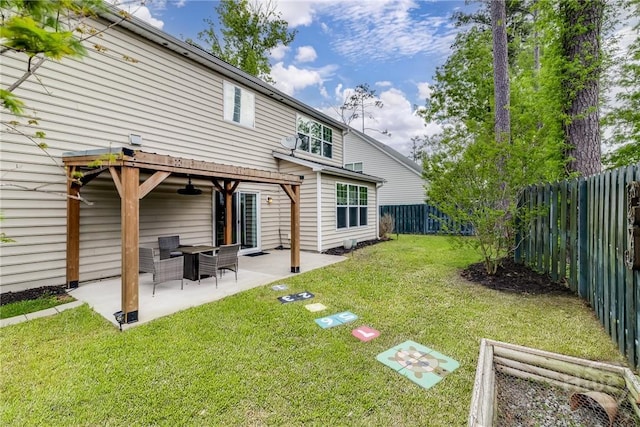 55 Glen Way, Richmond Hill, GA 31324 - rear view of house featuring a fenced backyard, a ceiling fan, and a patio area