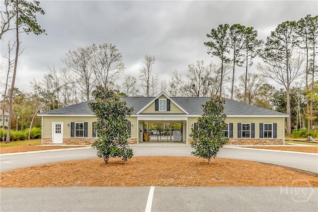 55 Glen Way, Richmond Hill, GA 31324 - view of property featuring concrete driveway and a carport