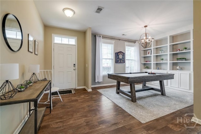55 Glen Way, Richmond Hill, GA 31324 - entryway with plenty of natural light, dark wood-style flooring, and a chandelier