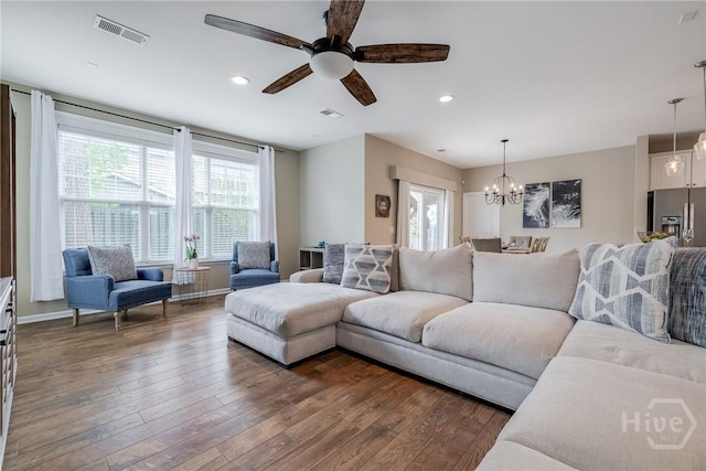55 Glen Way, Richmond Hill, GA 31324 - living room with a ceiling fan, a chandelier, dark wood-style flooring, and recessed lighting