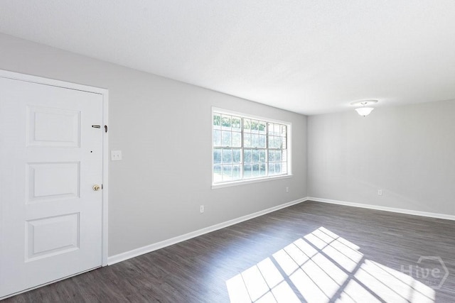 84 Poplar St, Guyton, GA 31312 - unfurnished room featuring dark wood-type flooring and baseboards