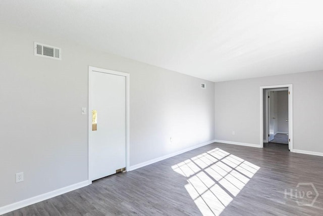 84 Poplar St, Guyton, GA 31312 - empty room with wood finished floors and baseboards