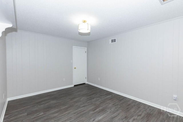 84 Poplar St, Guyton, GA 31312 - empty room with dark wood finished floors and baseboards