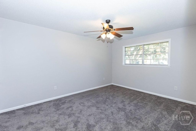 84 Poplar St, Guyton, GA 31312 - empty room featuring ceiling fan and dark colored carpet