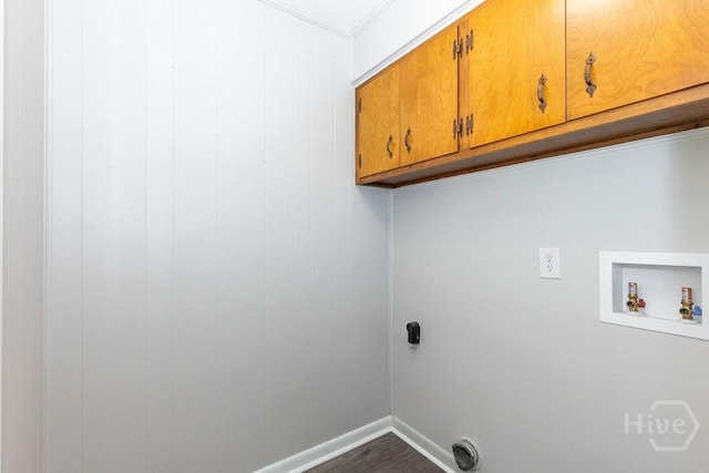 84 Poplar St, Guyton, GA 31312 - washroom featuring cabinet space, washer hookup, electric dryer hookup, dark wood-style flooring, and ornamental molding