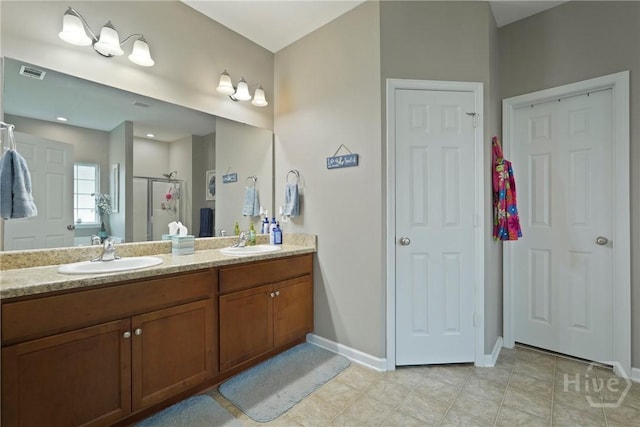 227 Chippingwood Cir, Pooler, GA 31322 - bathroom featuring a shower stall, double vanity, and tile patterned flooring