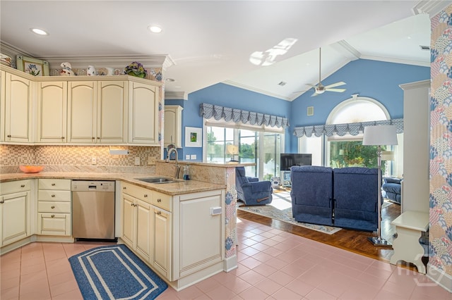 24 Islanders Retreat Retreat, Savannah, GA 31411 - kitchen with cream cabinetry, stainless steel dishwasher, light tile patterned floors, a peninsula, and open floor plan