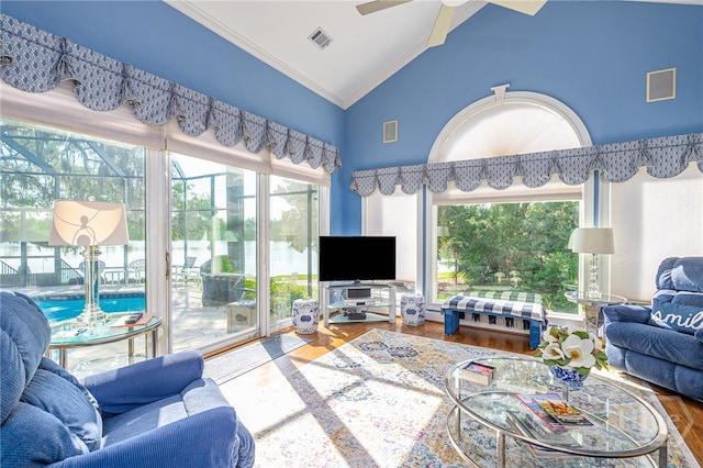 24 Islanders Retreat Retreat, Savannah, GA 31411 - living room with lofted ceiling, healthy amount of natural light, wood finished floors, crown molding, and ceiling fan